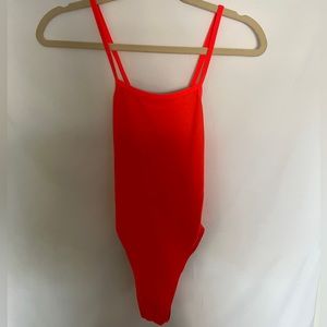 Jolyn Gavin one piece with colorful cutouts